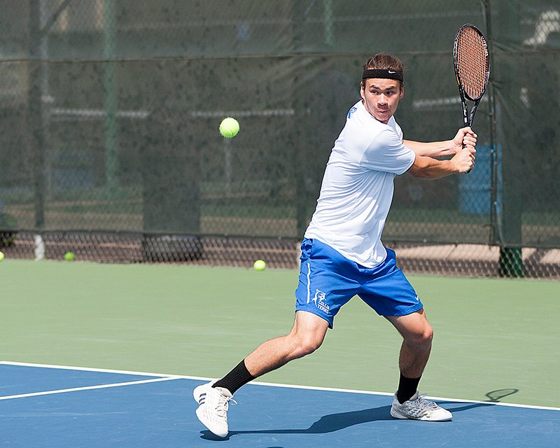 Collin College tennis player readying a backhand