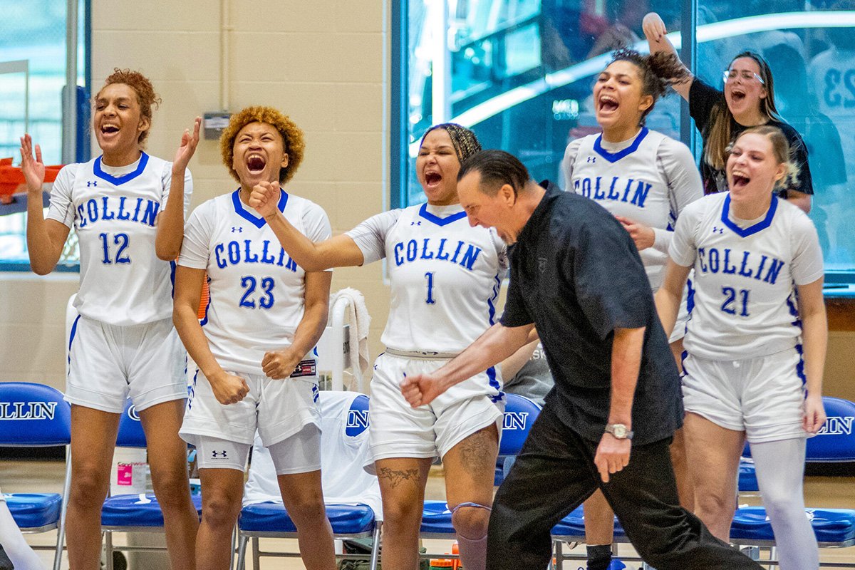 Collin College Lady Cougars team members and Coach Jeff Allen celebrate a clutch basket in a comeback win over McLennan Community College in January.